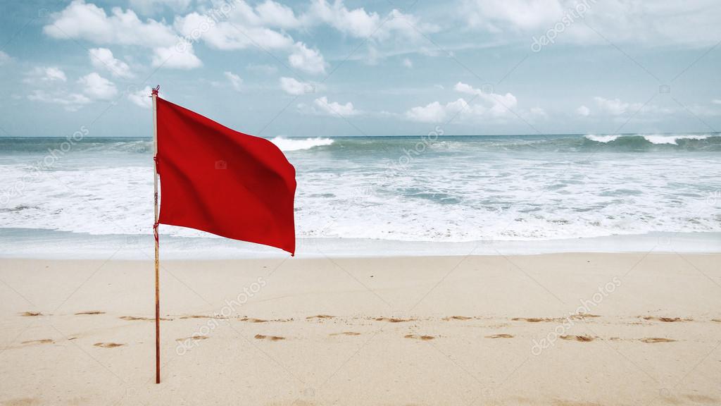 Red flag on the beach on the island of Bali, warning that swimming is prohibited