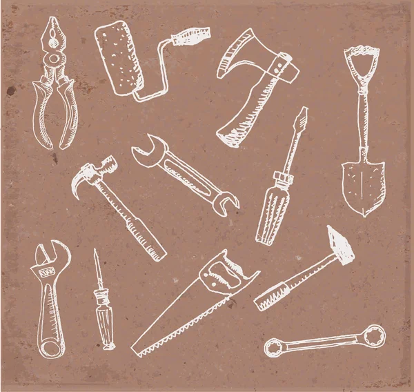 Herramientas dibujadas a mano sobre papel marrón . — Archivo Imágenes Vectoriales