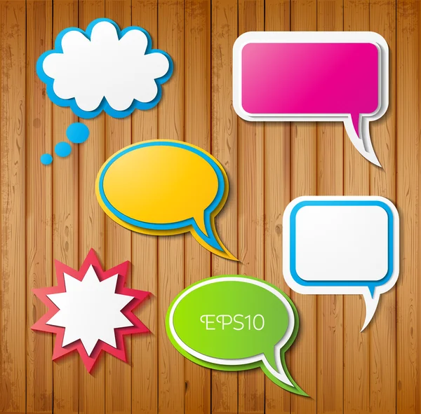 Paper-cut speech bubbles on wooden background — Stock Vector