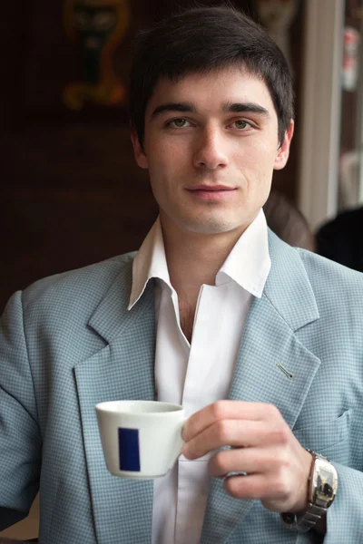 The man with a cup of coffee — Stock Photo, Image