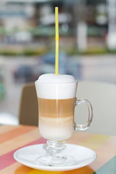 Tall cup of fresh coffee latte with wipped cream — Stock Photo, Image