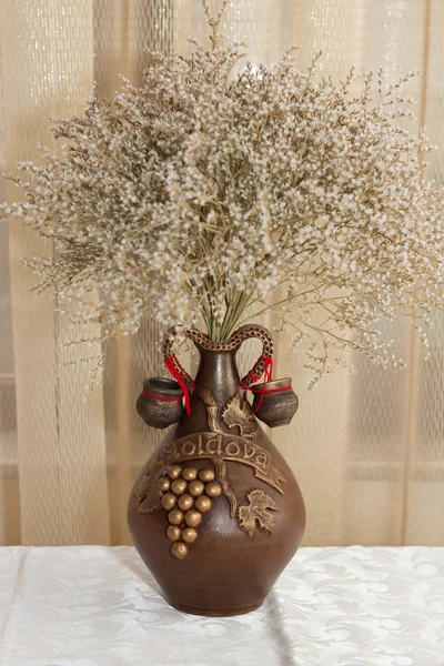 Jug with dry wild flowers — Stock Photo, Image