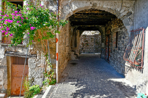 A narrow street of Villa Santo Stefano, a medieval town of Lazio region, Italy.