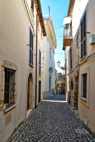 An narrow street of Villa Santo Stefano, a medieval town of Lazio region, Italy.
