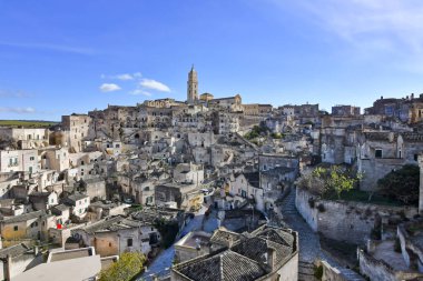 Matera 'nın manzarası, kayanın içine inşa edilmiş antik bir şehir. İtalya 'nın Basilicata bölgesinde yer almaktadır..