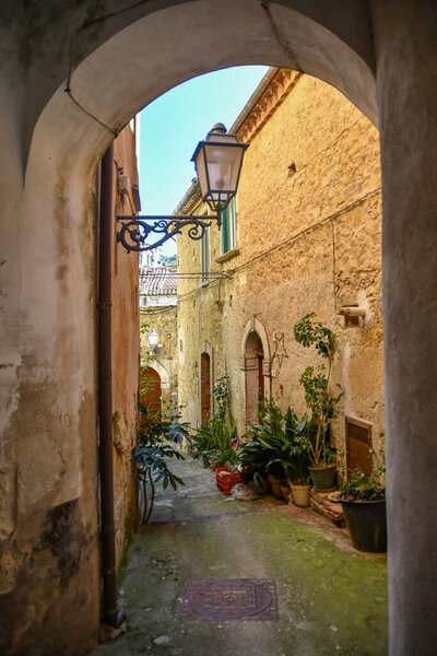 A narrow street among the old stone houses of Altavilla Silentina, town in Salerno province, Italy.