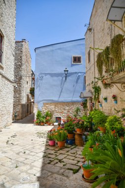 A narrow street between the old houses of Casamassima, an Apulian village in the province of Bari, Italy.