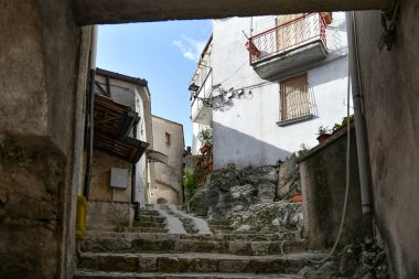 A narrow street between the old houses of Petina, a village in the mountains of Salerno province, Italy.