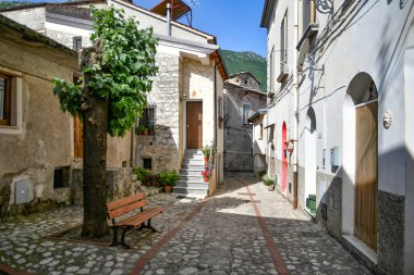 A narrow street between the old houses of Petina, a village in the mountains of Salerno province, Italy.