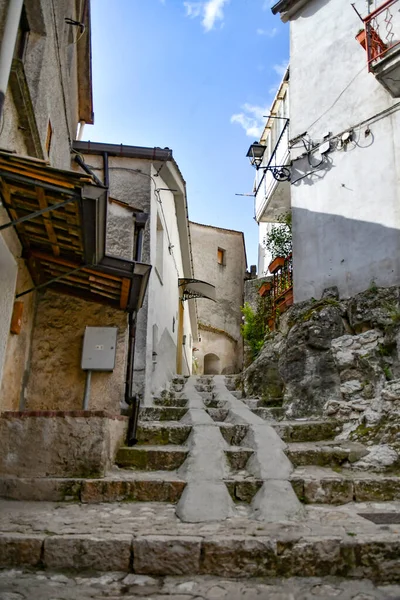 A narrow street between the old houses of Petina, a village in the mountains of Salerno province, Italy.