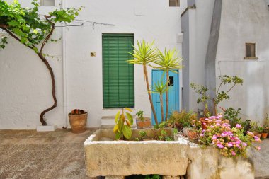The door of an old house in Presicce, an Apulian town in the province of Lecce, Italy.