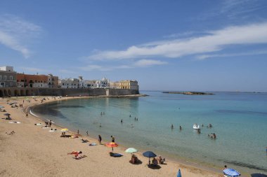 The beach below the old town of Gallipoli, in the province of Lecce, Italy.