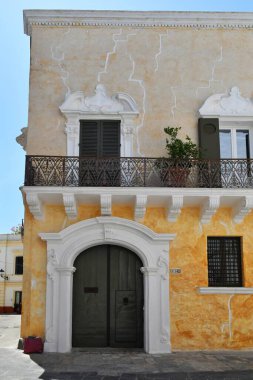 The facade  of an old  house in Gallipoli, an old village in the province of Lecce in Italy.