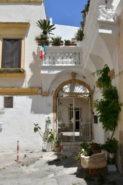 The facade  of an old  house in Gallipoli, an old village in the province of Lecce in Italy.