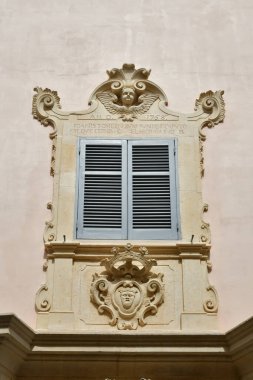 The window of an ancient house the historic center of Tricase, a medieval town in the Puglia region, Italy.