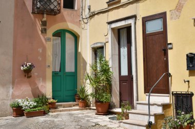The door of an ancient house in the historic center of Tricase, a medieval town in the Puglia region, Italy.