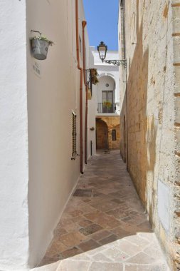A street in the historic center of Specchia, a medieval town in the Puglia region, Italy.