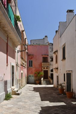 A street in the historic center of Specchia, a medieval town in the Puglia region, Italy.
