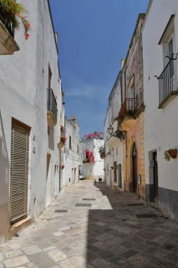A street in the historic center of Specchia, a medieval town in the Puglia region, Italy.