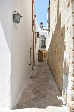 A street in the historic center of Specchia, a medieval town in the Puglia region, Italy.