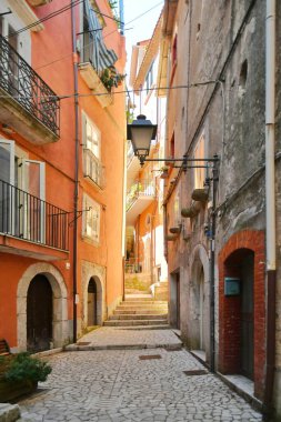 A narrow street between the old houses of Guardia Sanframondi, a village in the province of Benevento, Italy.