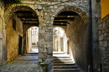 A narrow street between the old houses of Guardia Sanframondi, a village in the province of Benevento, Italy.