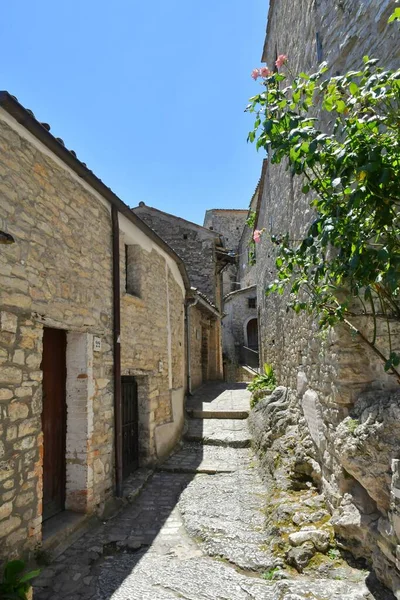 A narrow street between the old houses of Pietrelcina a village in the province of Benevento, Italy.