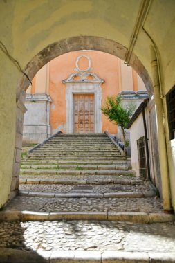 The entrance door into a medieval church in Sulmona, an Italian village in the Abruzzo region.