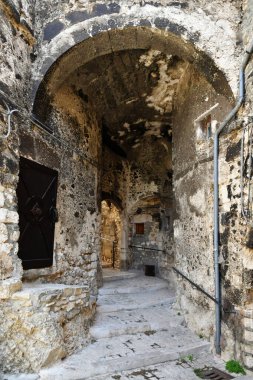 A street among the old stone houses of Campo di Giove, a medieval village in the Abruzzo region of Italy.