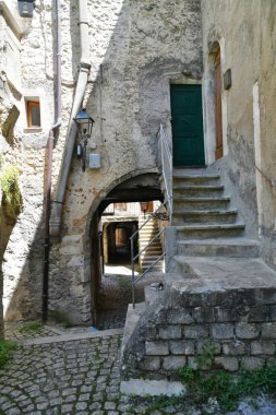 A street among the old stone houses of Campo di Giove, a medieval village in the Abruzzo region of Italy.