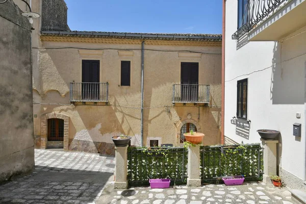 A street between the old houses of Tricarico, a rural village in the Basilicata region, Italy.