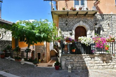A narrow street among the old houses of Greci, a village in the Campania region, Italy.