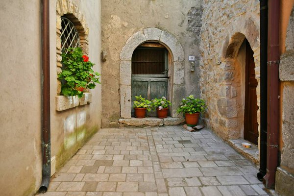 The door of an old house in Pietraroja, a medieval village in the province of Benevento in Campania, Italy.