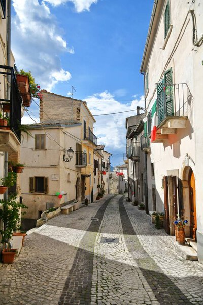 A narrow street between the old stone houses of Caramanico Terme, a medieval village in the Abruzzo region of Italy.