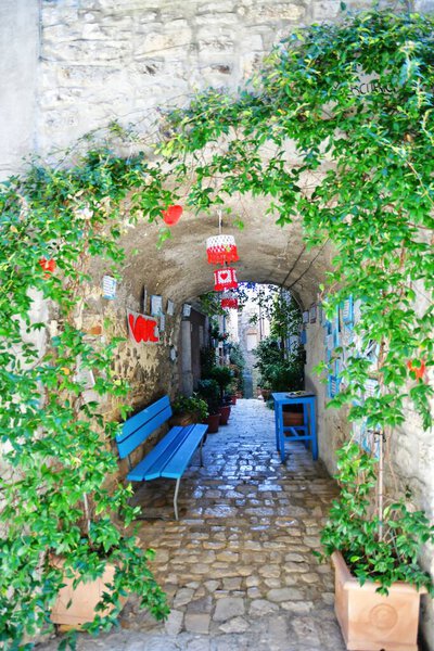 A narrow street between the old stone houses of Oratino, a medieval village in the Molise region of Italy.