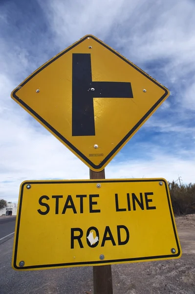 State line road sign