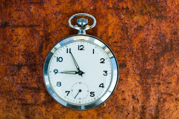 Pocket watch on rust — Stock Photo, Image