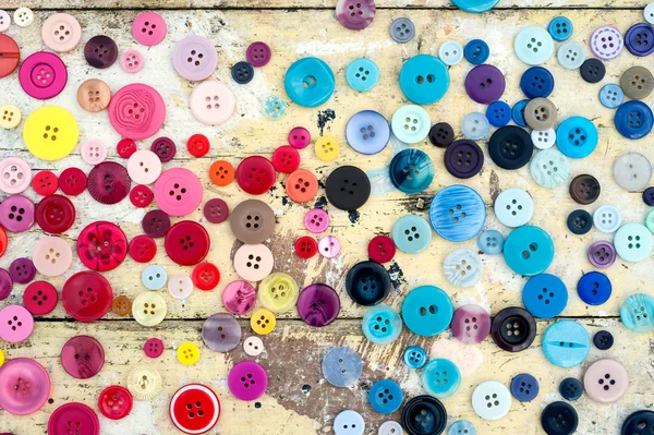 Grungy sewing buttons background — Stock Photo, Image