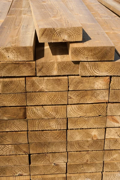 Stacks of wood planks in lumber yard — Stock Photo, Image