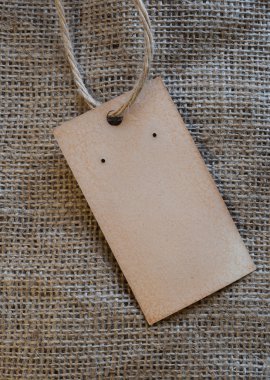 El yapımı antika etiketi etiket çuval bezi arka plan üzerinde