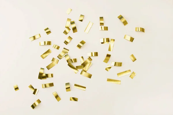 Golden Confetti Tinsel Isolated Gray Background — Stock Photo, Image