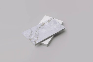 Kartvizitler, üst kartvizit mermer desenli ve altın damarlı.