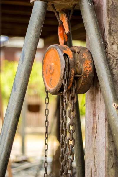 Chain hoist with a large wooden pole. — Stock Photo, Image