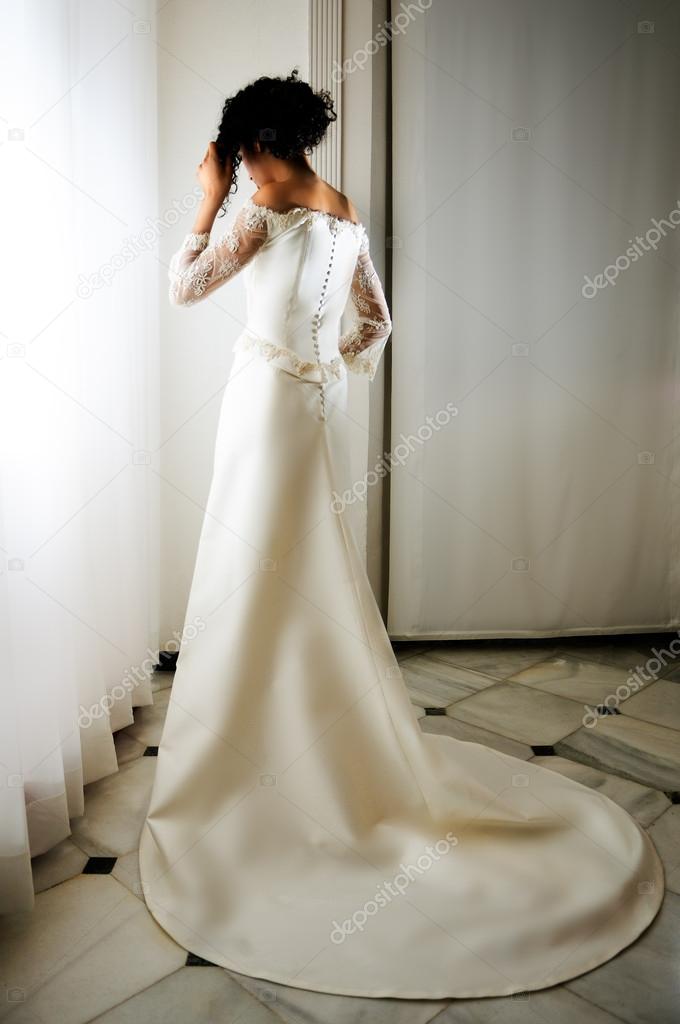 Young black woman, model of fashion, with wedding dress