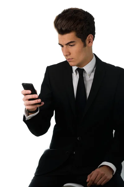 Schöner Geschäftsmann, der am Handy telefoniert, isoliert auf weiß — Stockfoto