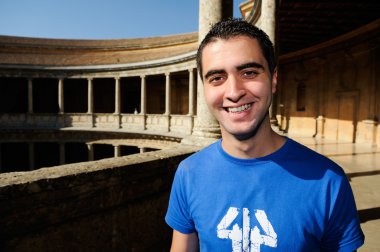 Attractive smiling man portrait in urban background