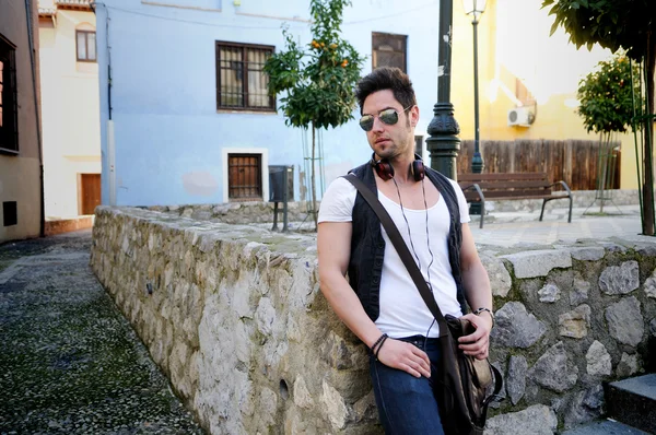 Portrait of young attractive man in urban background — Stock Photo, Image