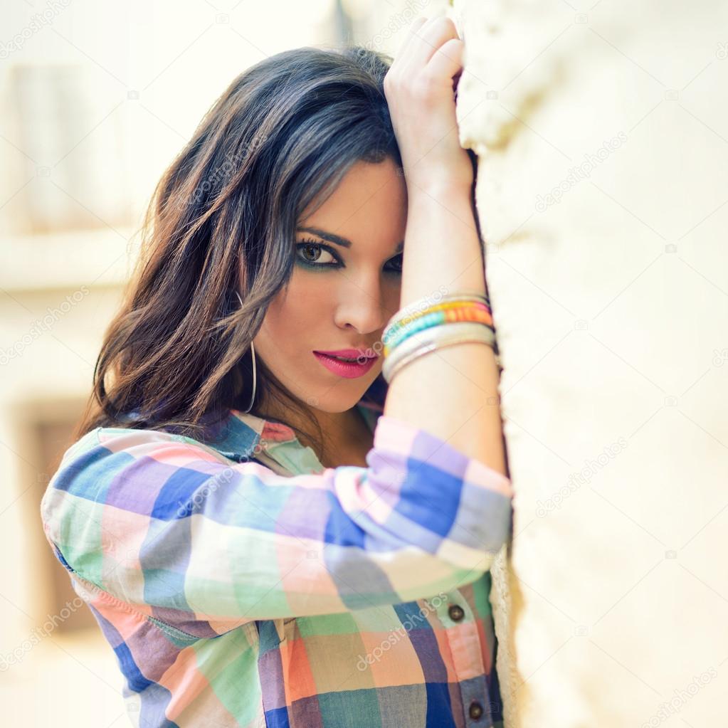 Young beautiful woman in a urban background