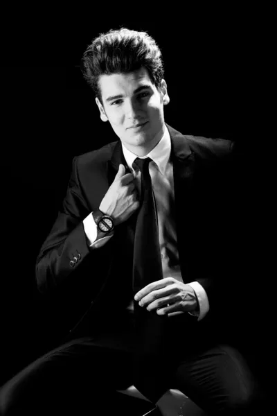 Young businessman, isolated on black background — Stock Photo, Image