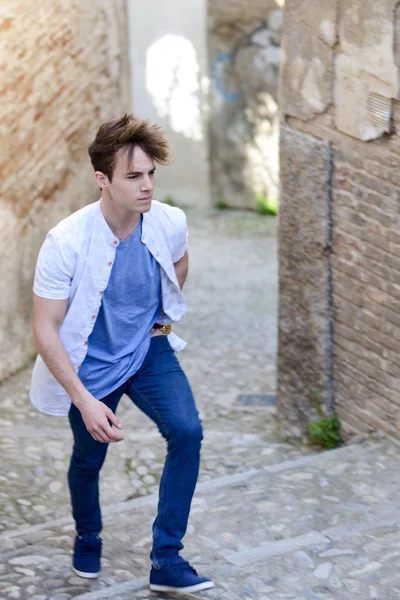 Attractive young man in urban background — Stock Photo, Image